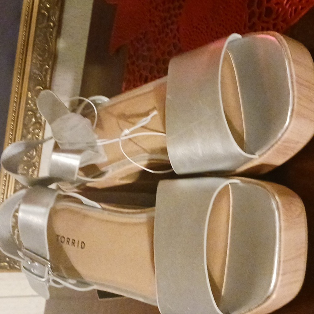 Urged Platform Heel Sandals Silver in color. New still have the tag.